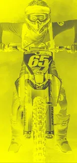 Motocross rider in bright yellow bursting through smoke on mobile wallpaper.