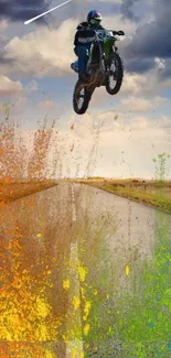 Vibrant motorbike jumping over colorful splash on road.