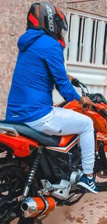 Motorcycle rider in vibrant urban setting with a blue jacket and red bike.