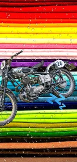 Colorful wallpaper featuring a vintage motorcycle in a rainbow-striped background.