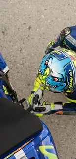 High-speed motorbike racer with vibrant helmet and bike on asphalt.