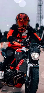 Red motorcycle rider against urban backdrop.