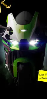 Green and black motorcycle with glowing lights on a dark background.