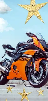 Orange motorcycle against a starry sky.