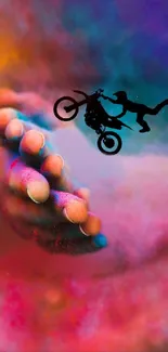 Vibrant and dynamic wallpaper with motorcycle stunt and colorful abstract background.