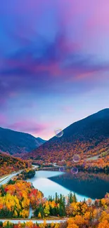 Vibrant mountain lake with autumn leaves and colorful sky.