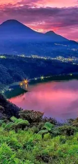 Vibrant sunset over mountains and lake.