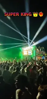Crowded music festival at night with colorful stage lights.