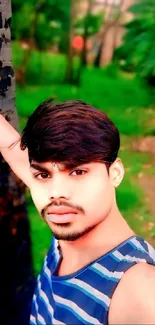 Vibrant nature portrait of a young man set against lush greenery.