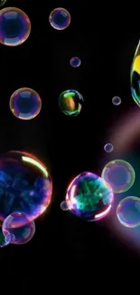 Neon bubbles floating on dark background wallpaper.