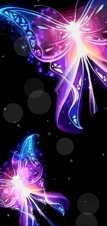 Colorful neon butterflies on a dark background wallpaper.