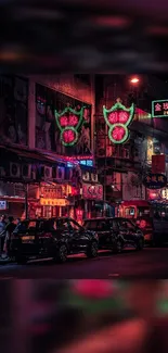 Vibrant cityscape with neon lights and bustling night street.