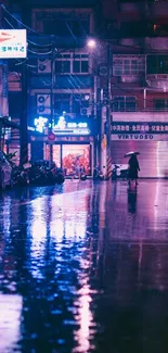 Neon-lit city street with reflections on wet pavement at night.