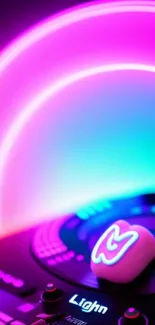 Vibrant neon DJ wallpaper with pink and blue glow and music-themed elements.