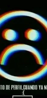 A neon emoticon with a sad face on a black background.