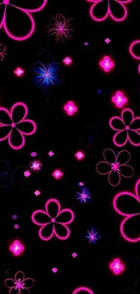 Vibrant neon flower pattern on dark background.