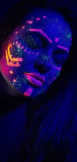 Neon UV face art in dark blue glow.