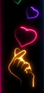 Neon heart design with glowing colors on a black background.