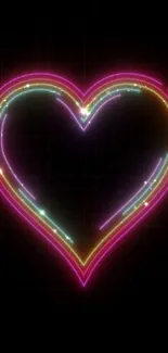 Vibrant neon heart design glowing against a black background.