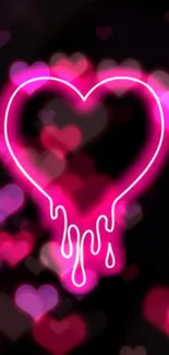 Glowing neon heart on black background with pink hue.