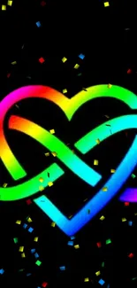 Vibrant neon heart with rainbow colors and confetti on black background.