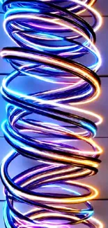 Colorful neon spiral with vibrant glow on dark background.