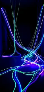 Neon light trails in blue, green, and purple on a dark background.