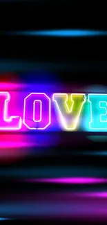 Colorful neon 'LOVE' sign on black background.