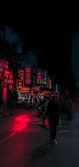 Urban nightscape illuminated by red neon lights on a bustling street.