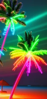 Vibrant neon palm trees light up a tropical beach at night.