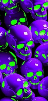 Vibrant purple skulls with neon green accents on a wallpaper.