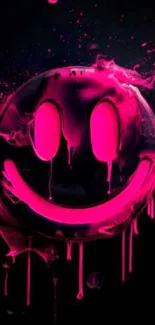 Neon pink smiley face with splashes on a dark background.