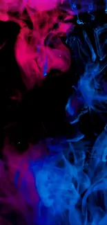 Neon pink and blue smoke on black background.