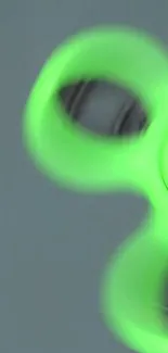 Neon green fidget spinner on a smooth background.