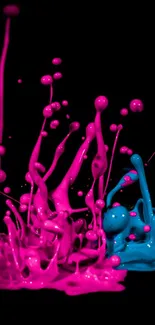 Vibrant neon splash with pink and blue paint on a dark mobile wallpaper background.