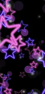 Vibrant neon star wallpaper with pink and purple stars on a black background.