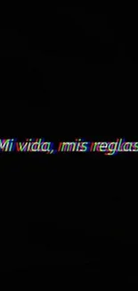 Vibrant neon text saying 'Mi vida, mis reglas' on a dark background.