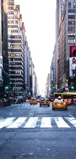 New York City street with taxis and skyscrapers.