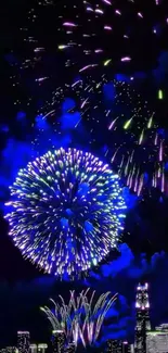 Fireworks illuminating a city skyline at night with vibrant colors.