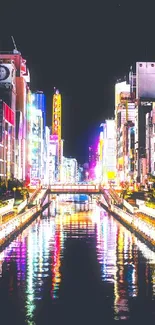 Vibrant cityscape with neon buildings and a reflective river at night.