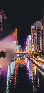 City nightscape with vibrant neon lights reflecting in a canal.