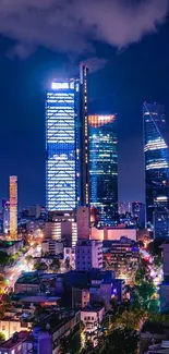 Night view of a city skyline with illuminated skyscrapers and vibrant colors.