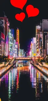 Vibrant night cityscape with neon lights reflecting in water.