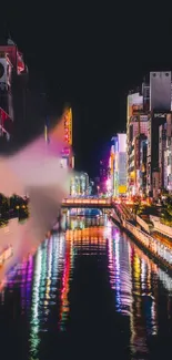 Vibrant night cityscape with colorful river reflections.