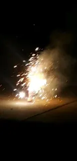 Nighttime fireworks explosion on pavement, sparking joy.