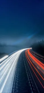 Night highway with vibrant red and white light trails creating dynamic motion.