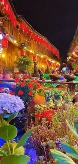 Vibrant street garden illuminated by colorful lights and flowers at night.