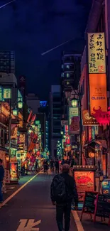 Vibrant Tokyo street at night with colorful neon lights and signs.