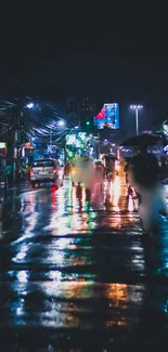 Night street scene with vibrant lights reflecting on a wet road.