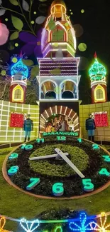 Vibrant clock tower with colorful night lights.